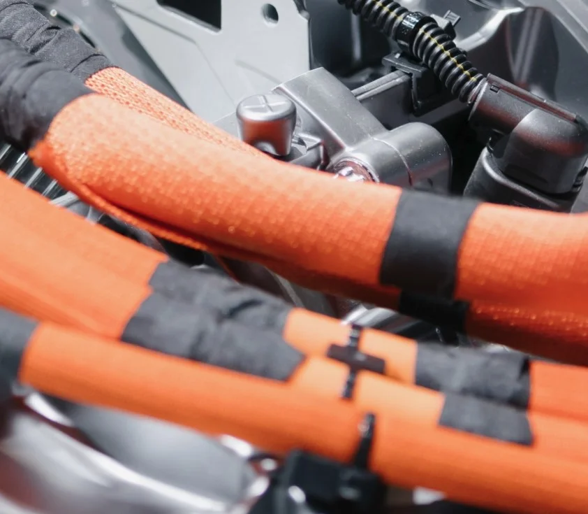 Internal EV Electric cable and wiring. Bright orange.