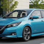 Blue Nissan Leaf on side of the road